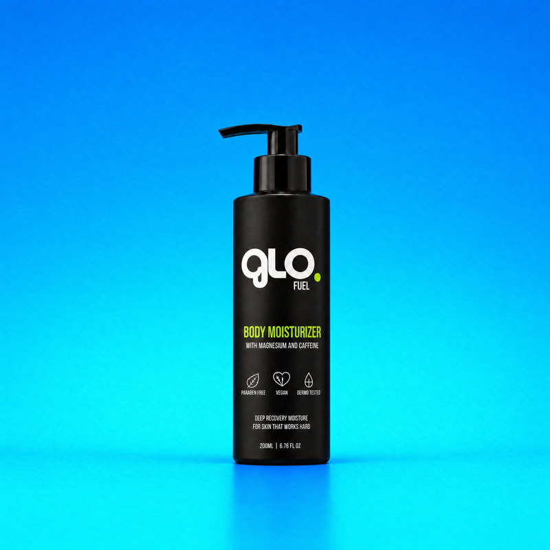 A black pump bottle of GLO Fuel Body Moisturizer with Magnesium and Caffeine, set against a vibrant blue gradient background.