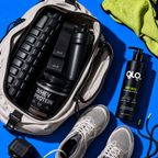 An open beige backpack on a bright blue background displays a black shaker bottle, a black tub of whey protein powder, and a black pump bottle of GLO Fuel body wash, alongside gray athletic shoes and a neon yellow towel.
